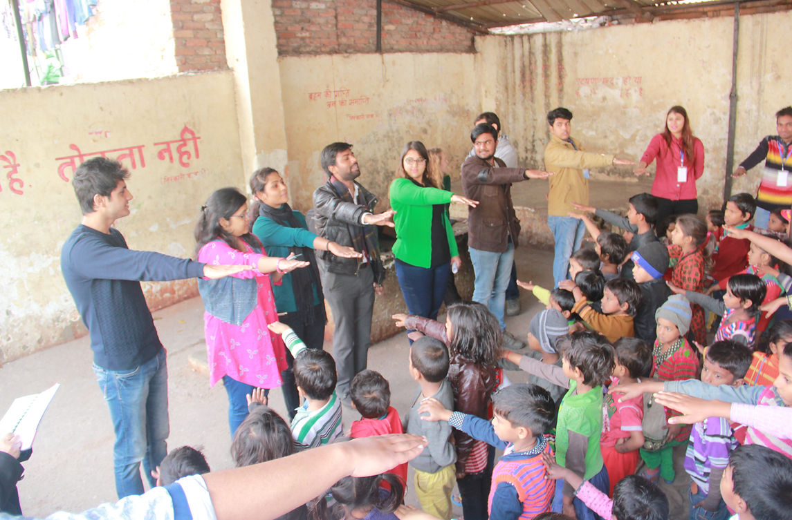Volunteers conducting community youth engagement and pledge